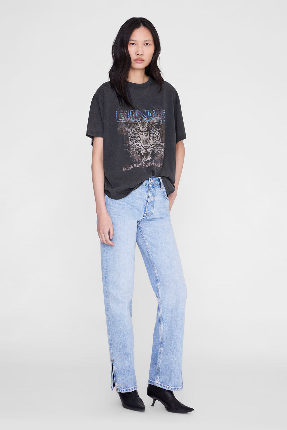 Anine Bing Cade Tee Leo Muse Washed Black worn with light wash denim