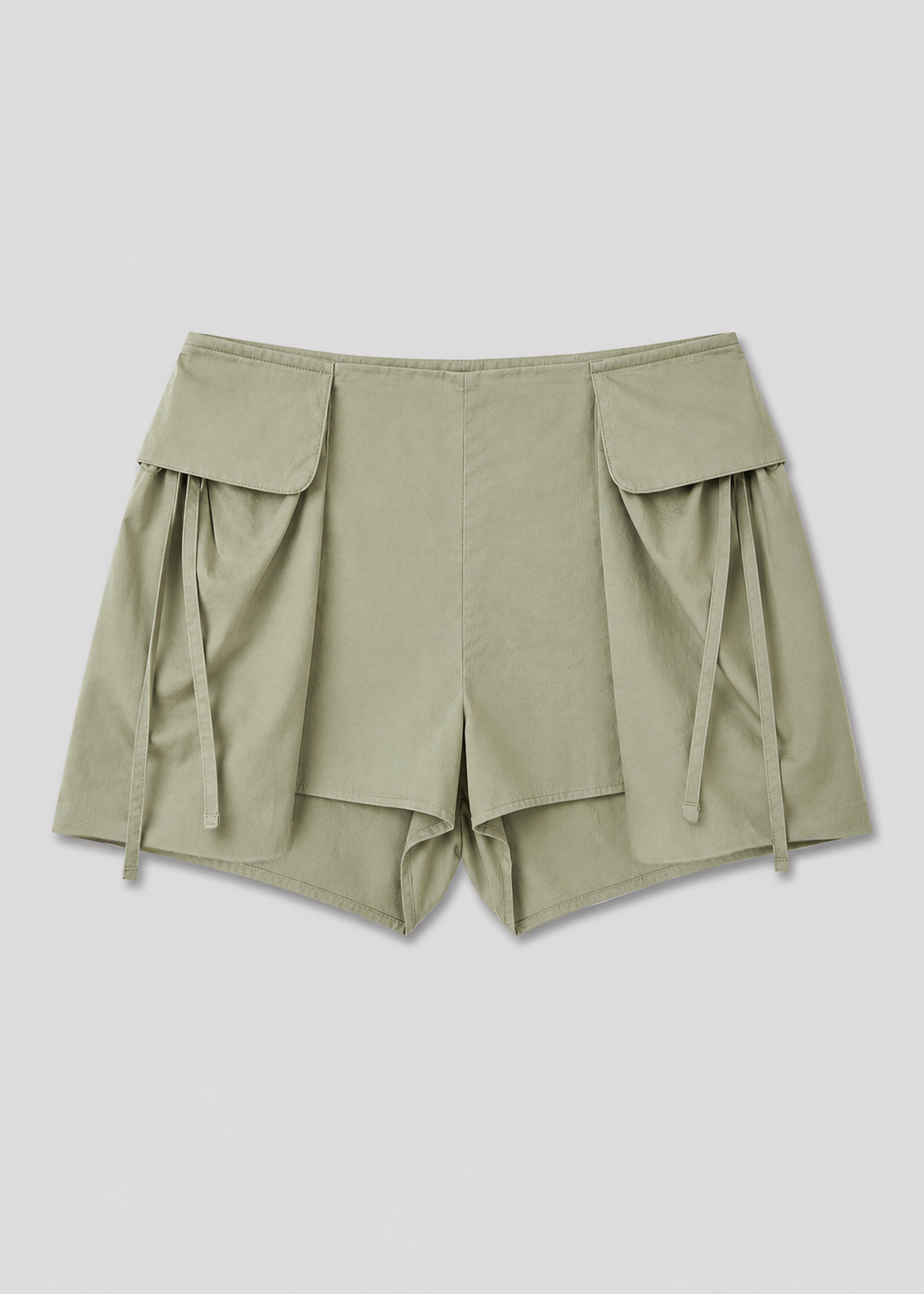 Deiji Studios Micro Pocket Short in Stone Green – flat lay product shot | Peggy Concept Store