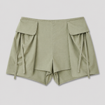 Deiji Studios Micro Pocket Short in Stone Green – flat lay product shot | Peggy Concept Store
