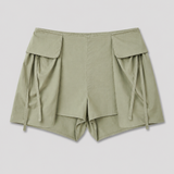 Deiji Studios Micro Pocket Short in Stone Green – flat lay product shot | Peggy Concept Store