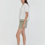 Deiji Studios Micro Pocket Short in Stone Green – front view, side angle | Peggy Concept Store