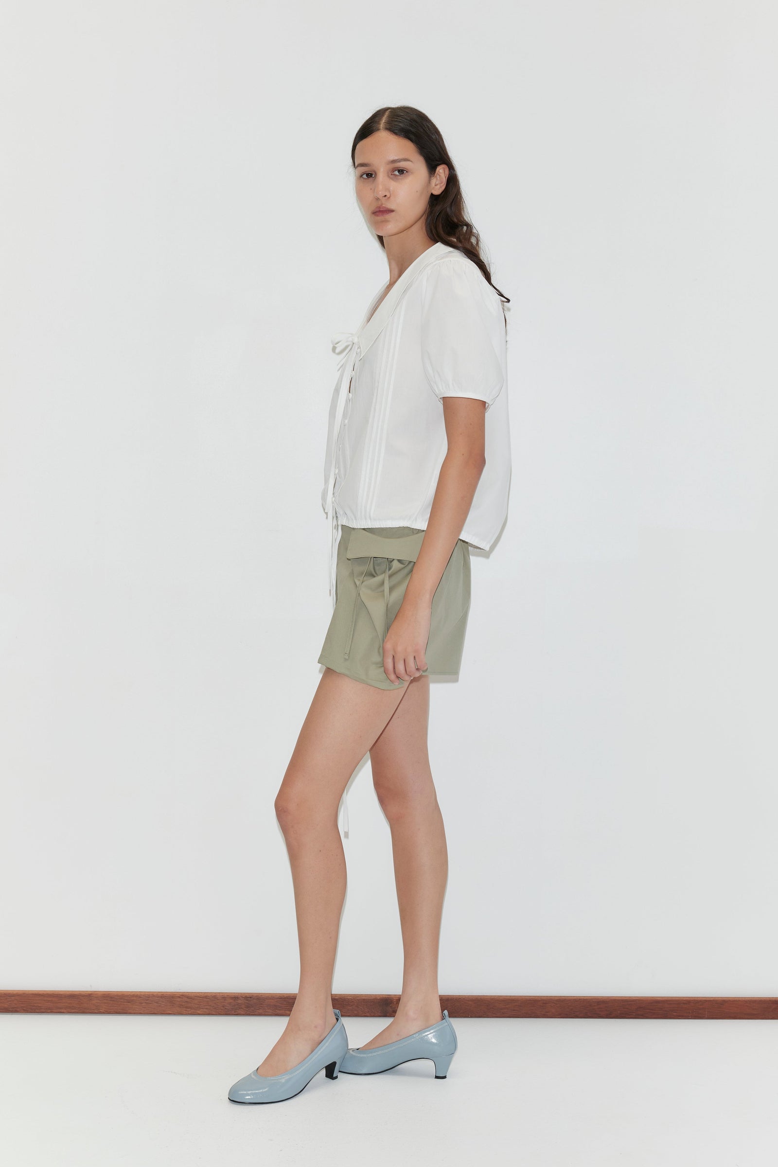 Deiji Studios Micro Pocket Short in Stone Green – front view, side angle | Peggy Concept Store