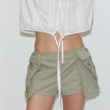 Deiji Studios Micro Pocket Short in Stone Green – detail view of envelope pockets | Peggy Concept Store