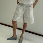 Deiji Studios Pintuck Short in White – styled view | Peggy Concept Store