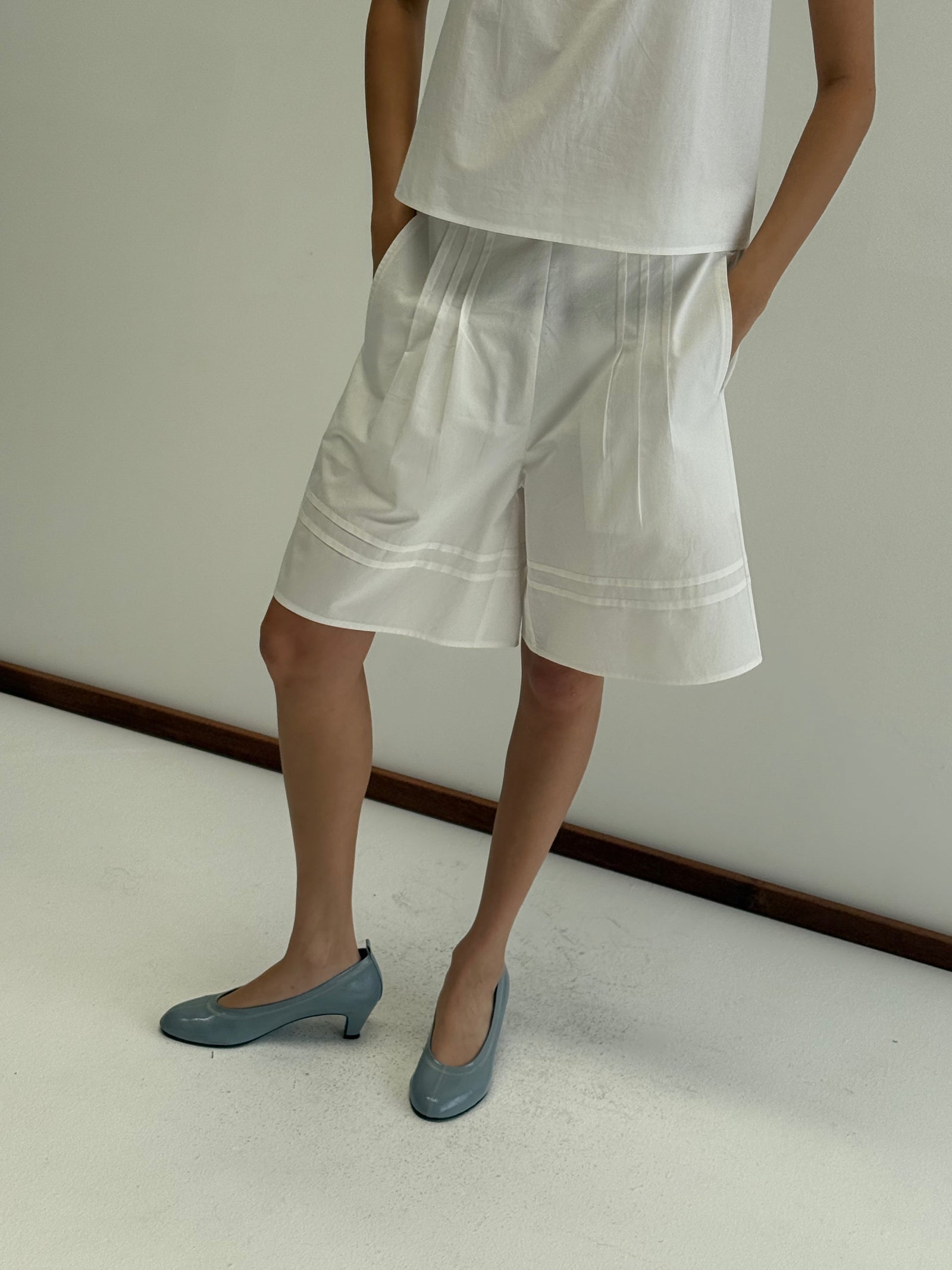 Deiji Studios Pintuck Short in White – styled view | Peggy Concept Store