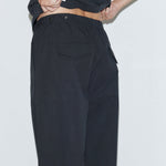Deiji Studios Snap Tab Pant in Black – detail view of snap tab waistband | Peggy Concept Store