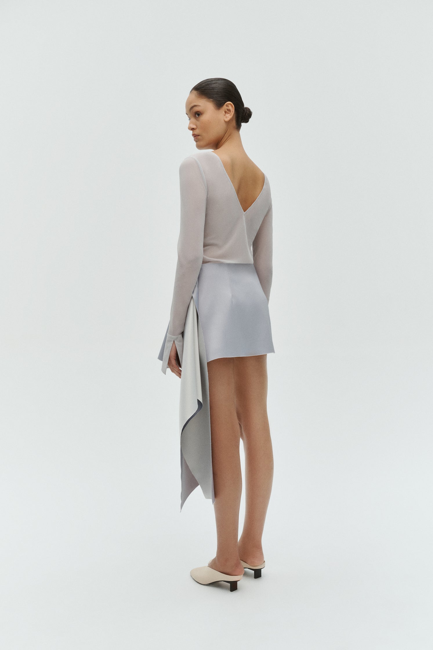 Women’s reversible top in silver styled for evening