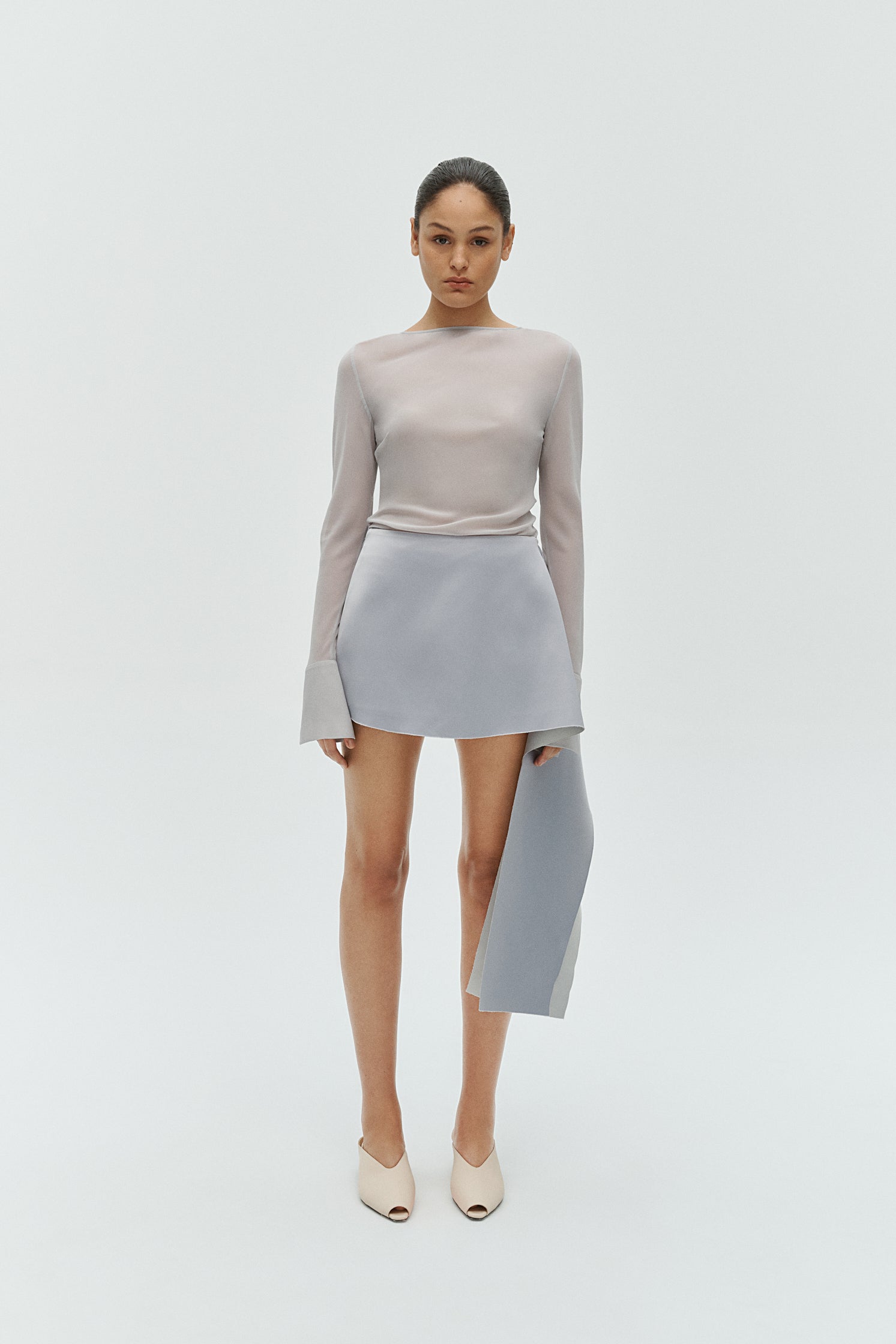 Silver reversible top styled with tailored skirt